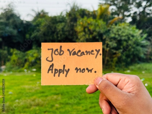 We are hiring trendy card post holding by hand, Join our team recruiting message, Drop your CV sticky note message, Vacancy here image