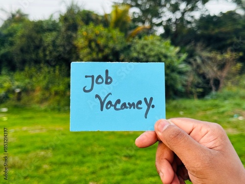 We are hiring trendy card post holding by hand, Join our team recruiting message, Drop your CV sticky note message, Vacancy here image