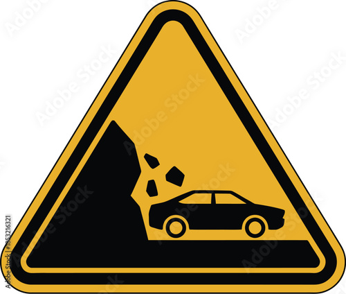 Road warning sign for falling rocks on mountain road