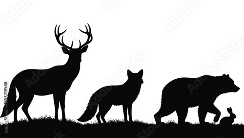 Silhouettes of deer fox bear and rabbit on grassy field