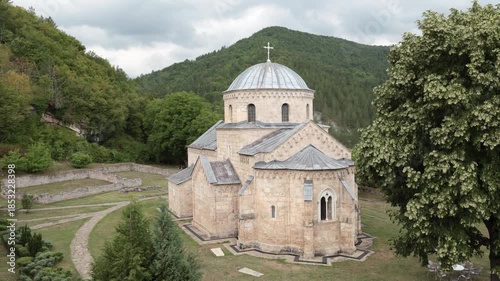 Central church building of Gradac monastery, Serbia. Austere design, sandstone walls, and narrow loophole windows represent religious European architecture of 14th century. 