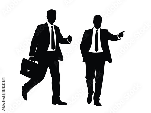 Two businessmen walking in formal suits with briefcases