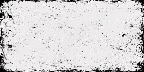 A dark black and white grunge background featuring a dirty textured wall surface with an old paint splash and rough gray ink pattern for a grungy paper wallpaper design