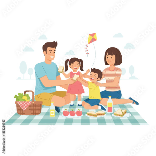 Happy Family Enjoying a Picnic Together Outdoors on a Sunny Day With a Kite Flying