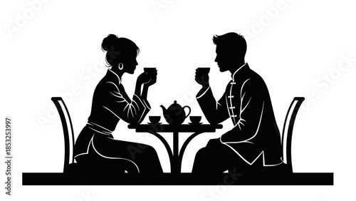 Silhouette of couple enjoying tea ceremony in traditional chinese attire
