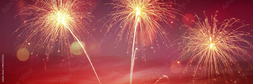Obraz premium Vibrant Red Fireworks Display with Golden Bursts and Soft Bokeh for Chinese New Year Celebrations Wedding Events and Festive Gala Marketing