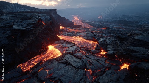 Volcanic landscape with molten lava and fractured terrain, showcasing natural geological activity.
