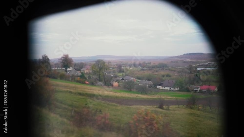 A beautiful view of nature from a train window during a journey. A railway in the mountains.