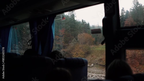 A beautiful view of nature from a train window during a journey. A railway in the mountains.