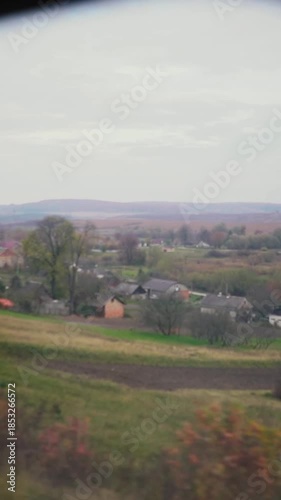 A beautiful view of nature from a train window during a journey. A railway in the mountains.