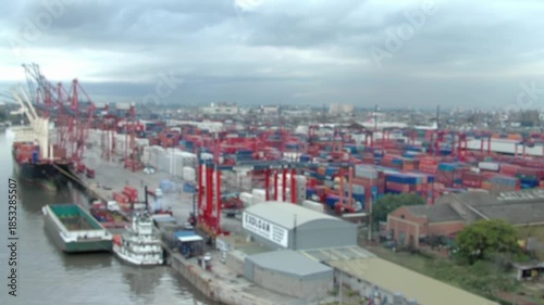 Blurred Container Terminal With Gantry Cranes And Stacked Containers, Port Operations