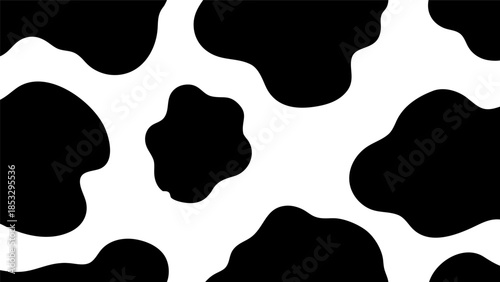 A seamless pattern of black and white cow spots, creating a textured background for creative design projects
