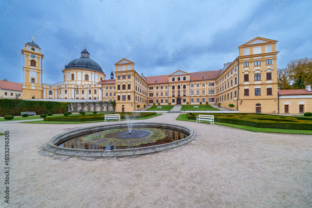 Obraz premium View of Jaroměřice nad Rokytnou Castle with Adjacent Park, Fountain, Benches, and Lightly Clouded August Sky, Czech republic, Moravia