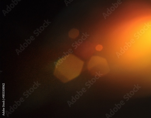 grainy colorful warm orange light leaks on black background with dust texture abstract damaged scratched retro film analog effect for using over photos as overlay or screen filter
