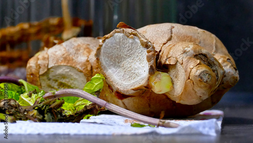 Ground and fresh ginger root, on a wooden table, rustic style, selective focus, no people,