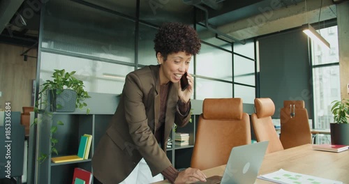 Uplifted female executive expressing joy at achievement