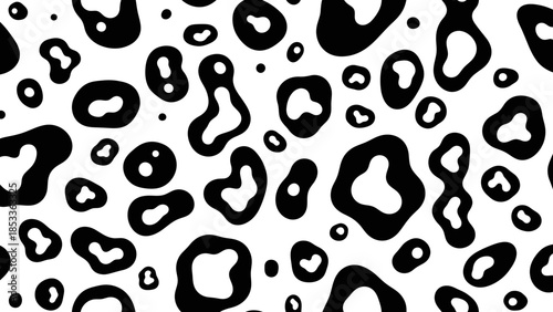 A seamless pattern of black and white abstract organic shapes resembling animal spots or ink blots.