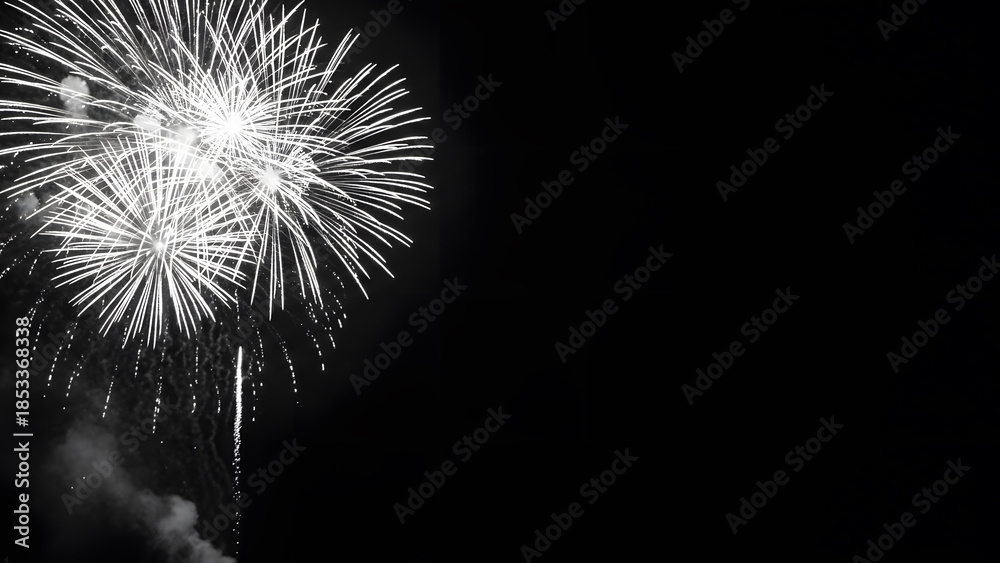 Fototapeta premium Monochrome Fireworks Explosion on Black Background With Copy Space