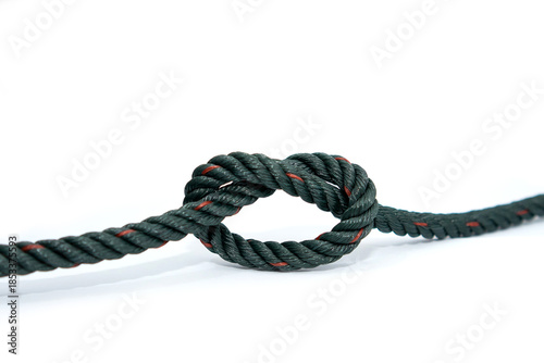 Schilderij op canvas A single dark green twisted rope with red tracer highlights, tied into a simple