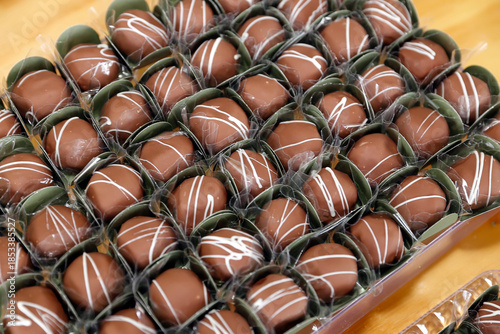 Mini Milk Chocolate Truffles with White Drizzle for Festive Events
