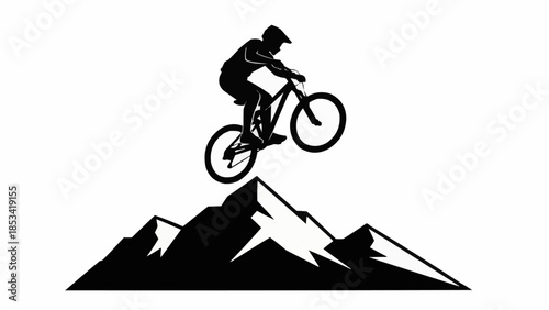 Mountain bike rider performing jump on peak.