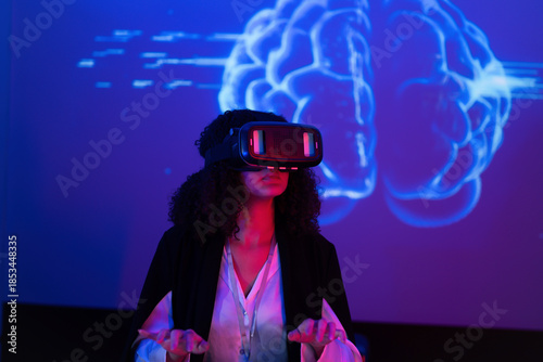 Exploring virtual reality technology with a headset and brain visuals in an interactive setting