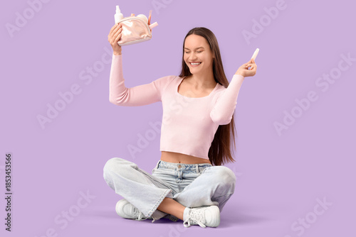 Happy young woman with cosm...