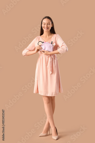 Young woman with cosmetic b...