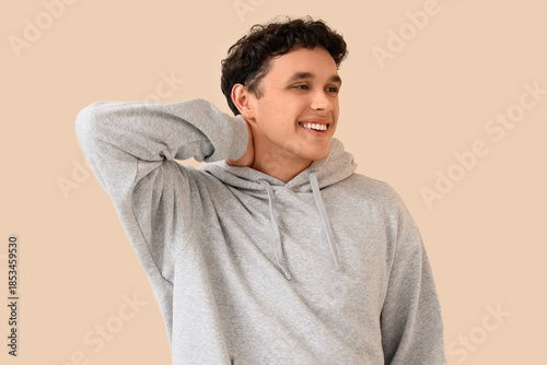 Young man in grey hoodie on...