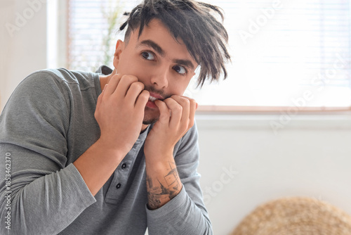 Young man having panic atta...