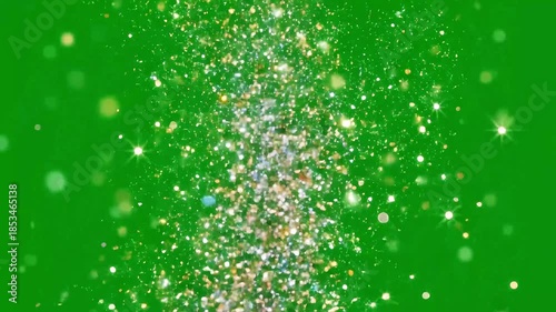Sparkling Glitter Particles Exploding on Green Screen Background.