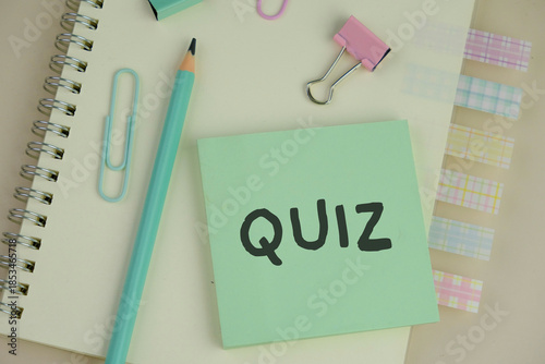 the words Its Quiz on green paper. the concept of answering quizzes or quiz games