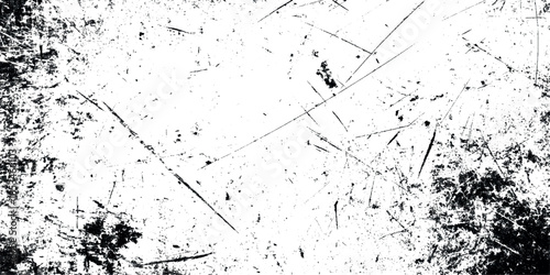 A distressed textured surface with dark edges and random scratches across a predominantly white background