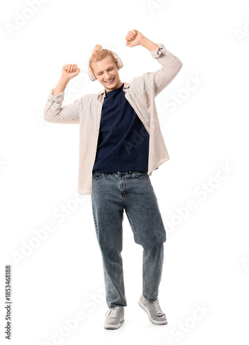 Young blonde man in headpho...