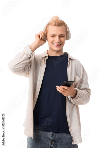 Young blonde man in headpho...