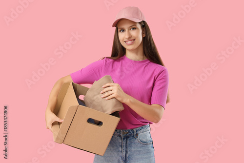 Young woman with cardboard ...
