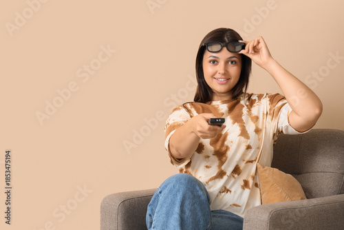 Young woman with remote con...