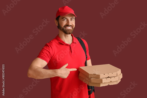 Male courier pointing at pi...