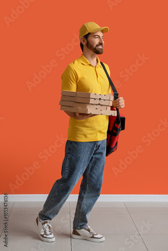 Male courier with pizza box...