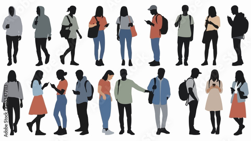 Diverse group of young people standing and interacting with technology.