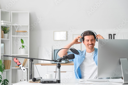 Male radio presenter with h...