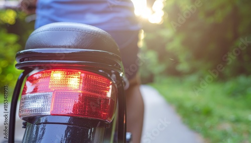 Close up of a scooter tail light on a sunny day.