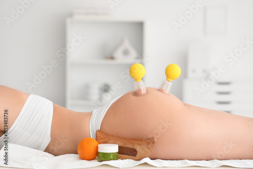 Young woman with vacuum jar...