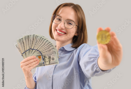 Young woman with bitcoin an...