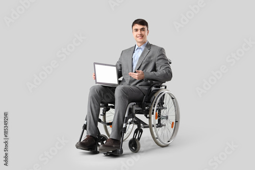 Young businessman in wheelc...