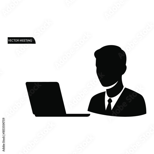 Businessman working on laptop in modern office setting