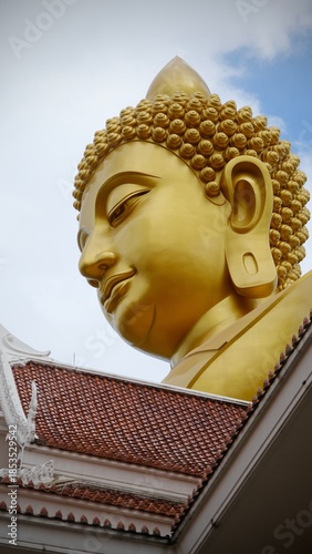 Bangkok, Thailand - September 25 2025 : The giant seated buddha statue at the Wat Paknam Phasi Charoen temple, Famous place in Bangkok.
