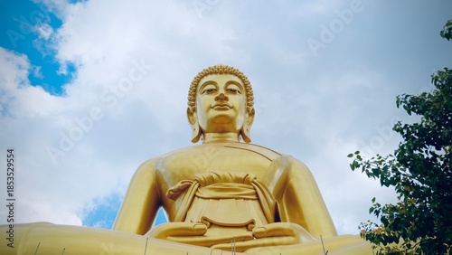 Bangkok, Thailand - September 25 2025 : The giant seated buddha statue at the Wat Paknam Phasi Charoen temple, Famous place in Bangkok.
