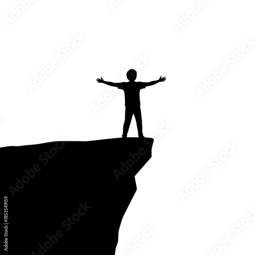 Silhouette of a person standing with arms outstretched on a cliff edge