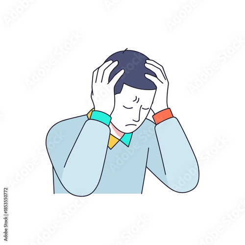 Young man feeling stressed and holding his head in discomfort  